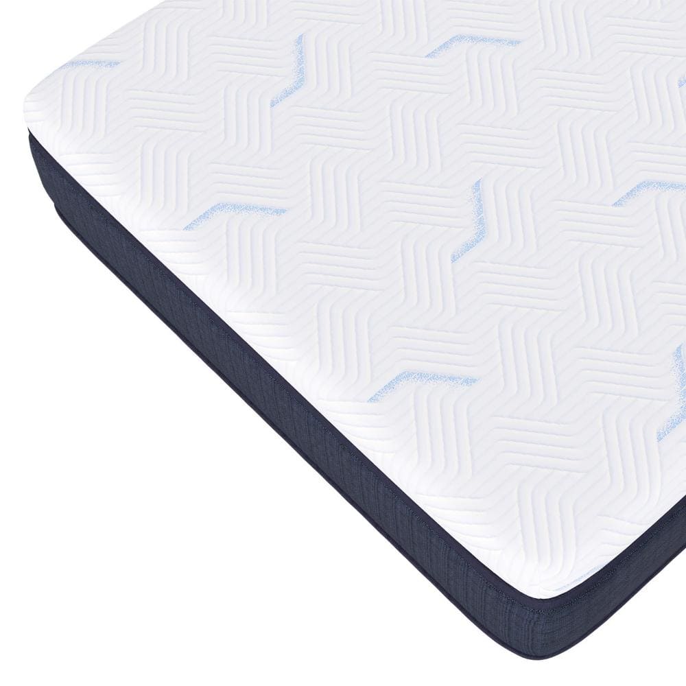 A close-up of Southerland's Palisades Mattress shows its thick, modern design. The top features a white cover with a subtle zigzag pattern, and the side is adorned in dark fabric, highlighting the brand's craftsmanship.