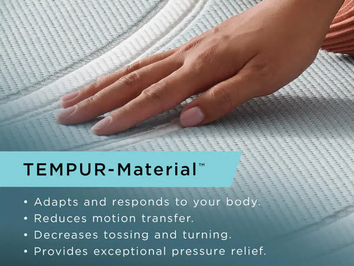 A person's hand pressing down on a light gray Tempur-Pedic TEMPUR-LuxeAdapt® 13" Soft Mattress, which bulges slightly under the pressure, accompanied by text listing the benefits of the mattress.