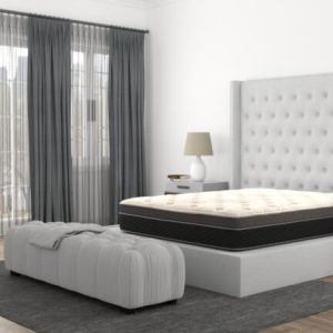 Elegant modern bedroom interior with king-size bed.