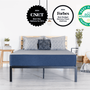 A neatly made bed featuring the AURORA LUXE COOLING mattress in blue and a wooden headboard is displayed in a minimalist bedroom. Three award badges hover above: 2024 CNET, 2024 Forbes Best Budget Memory Foam Mattress, and 2023 Good Housekeeping Best Family Travel Awards. The luxurious cooling features of the mattress ensure comfort all night long.