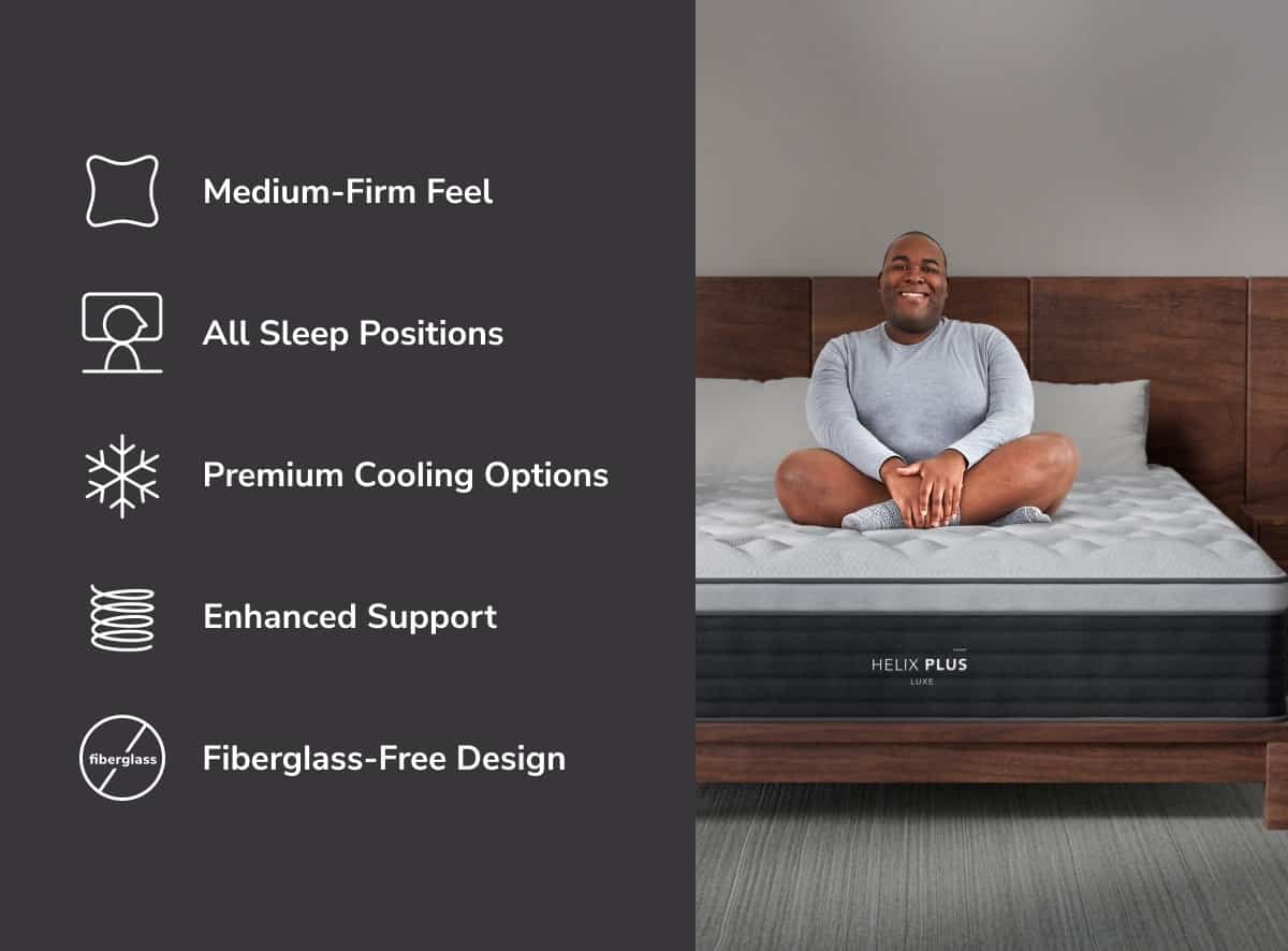 A person sits cross-legged on a HELIX Plus Mattress (Copy), appreciating its medium-firm feel. It's ideal for all sleep positions, featuring premium cooling options, enhanced support, and a fiberglass-free design. The mattress rests elegantly on a wooden bed frame.