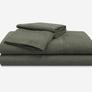 A Flannel Performance Sheet Set in dark green, comprising a fitted sheet, flat sheet, and two pillowcases, neatly stacked on a plain white background.