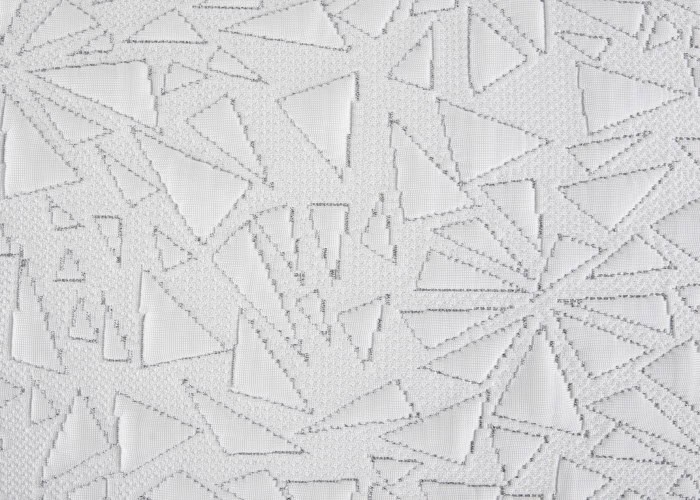 The TEMPUR-Breeze® ProHi Pillow showcases white fabric with an abstract geometric pattern of intersecting triangles, highlighted by subtle gray stitching for a textured and intricate look.