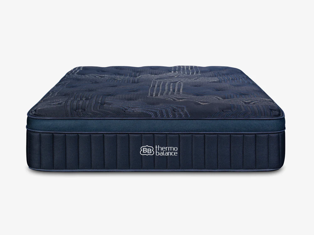 A dark blue, rectangular ThermoBalance Soft mattress with quilted top patterns and "BB thermobalance" branding on the side, shown against a plain white background.